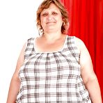 Pic of Fatty granny with huge boobs and ass stripping and spreading her legs