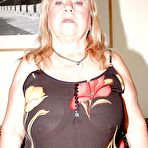 Pic of Fatty granny in nylon stockings stripping and rubbing her slit