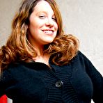 Pic of Amateur BBW Lisa Davidson frees her huge boobs from sweater in blue jeans