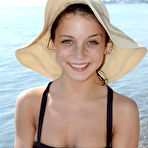 Pic of Barley legal teen takes off her clothes to poses nude on an air mattress