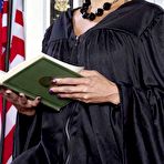 Pic of Hot MILF Claudia Valentine removes her judge's robes in her office