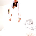 Pic of Teen bride Janice Griffith removing wedding dress before masturbating on bed