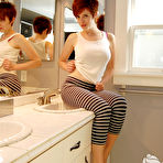 Pic of Redhead amateur Ryanne gets totally naked on the bathroom counter