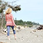 Pic of Busty mature woman Tasty Trixie goes barefoot at beach while exposing herself