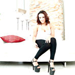 Pic of Curvy Latina spinner Becca Lee sliding yoga pants over round ass