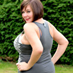 Pic of Amateur plumper Roxy uncovers her huge tits before touching her twat in a yard