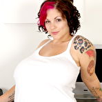 Pic of Chubby amateur babe Dors Feline strips and worships her large melons
