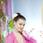 Pic of Cute brunette Emily Bloom in sheer lingerie and heels fingering shaved pussy