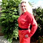 Pic of Mature blonde Barby touches her hairless pussy after disrobing in nylons
