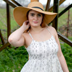 Pic of Country girl lifts her dress for naked upskirt showing bald twat and ass