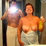 Pic of Busty older lady Busty Bliss engages in oral sex with her man friend