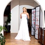 Pic of Sexy blond Katerina Hartlova oils her hooters before toying in a wedding dress