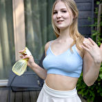 Pic of Blonde teen Lucia spritz her great body after getting totally naked