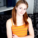 Pic of Teen first timer Dacey pets her natural pussy after uncovering her small tits