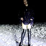 Pic of Caucasian girl Pinkycat pees on a snow-covered roadway at night in OTK boots