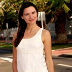 Pic of Dark haired girl flashes her bush in public before modeling naked by the sea