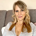 Pic of Middle-aged blonde Sweet Susi plays with her pussy after removing her leggings