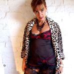 Pic of Over 30 amateur Georgie masturbates on a hardwood floor in stockings
