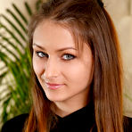 Pic of White teen with a pretty face Yarina A rolls off stockings to pose nude