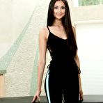 Pic of Solo girl with long black hair reveals her phat ass as she gets undressed