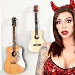 Pic of Solo girl Karma Rx sports devil horns while toying her shaved pussy