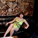 Pic of Amateur woman Hotmilf reveals her horny pussy on a black sofa