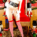 Pic of Frisky floosie in snazzy X-mas outfit revealing her pussy and big tits