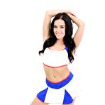 Pic of Dark-haired cheerleader Megan Rain works her phat ass while getting naked
