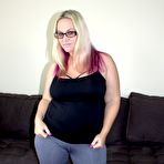 Pic of Fat chick with dyed hair does a striptease prior to interracial fucking