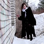 Pic of Blonde girl Alice Klay pisses in a window frame on a winter's day