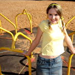 Pic of Cute teen exposes her bra and upskirt panties while at a playground