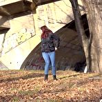Pic of Solo girl Amanda Hill pulls down her jeans for a pee behind a tree in public