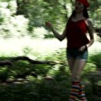 Pic of Young blonde Larisa takes a pee behind a tree in multi-coloured knee socks
