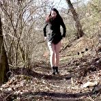 Pic of Caucasian girl Amanda Hill pees on dried leaves while on a path thru the woods