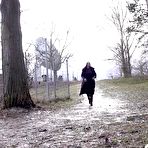 Pic of Blonde girl Bianca leans back against a tree while pissing in public