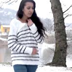 Pic of Brunette chick Esperansa pees against a tree upon snow-covered ground