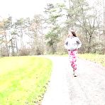Pic of Solo girl Valentina Ross pulls down her leggings to take a pee on a rural road