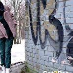 Pic of Caucasian girl Vasya pisses up against a brick wall in winter clothing