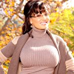 Pic of Mature brunette in glasses Lisa Ann reveals round tits & nice ass outdoors