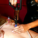 Pic of Blonde mistress tortures a restrained male slave during femdom play