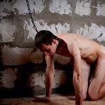 Pic of Russian mistress Lupe Burnett tortures a naked male in a basement