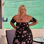 Pic of Mature blonde Melody looses her large breasts and fat ass from a dress