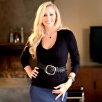 Pic of Ravishing MILF in stockings gets rid of her dress clothes and lingerie