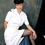 Pic of British nurse strips to her nylons and cap at the end of the work day