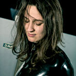 Pic of Brunette chick Ropemarks shows her bare ass while restrained in latex attire