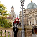 Pic of Clothed redhead Lara Larsen models latex attire and high heels in public