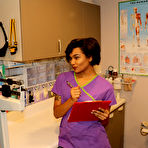 Pic of Fully clothed nurse dons latex gloves before giving a handjob at work