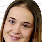 Pic of Cute chubby Elexis drops her jeans to pose naked on her knees showing hot ass