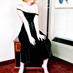 Pic of Cute redhead Barbie A casually looses her firm tits from a black dress