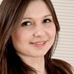 Pic of Cute teen amateur Slava Sanina plays with her naturally hairy twat